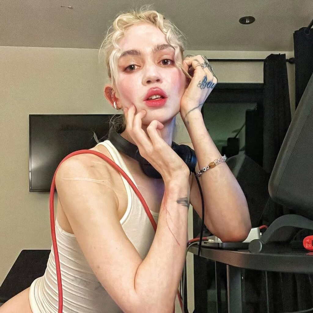 Grimes' Face Tattoo: Photo, Meaning